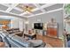 Spacious living room boasting coffered ceiling, dark wood floors, and an open layout to the kitchen at 1274 Cotton Gin Dr, Powder Springs, GA 30127