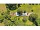 A bird's eye view of a metal structure surrounded by trees at 179 Hogan Rd, Brooks, GA 30205