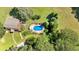 Aerial shot of home with inviting pool area featuring vibrant blue water at 179 Hogan Rd, Brooks, GA 30205