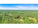 A bird's eye view of a lovely rural property surrounded by lush green trees at 179 Hogan Rd, Brooks, GA 30205