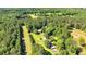 Aerial view featuring a rural property with trees at 179 Hogan Rd, Brooks, GA 30205
