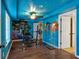 Finished basement showcasing wood flooring, custom paint job and workout equipment at 179 Hogan Rd, Brooks, GA 30205