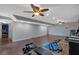 Finished basement area showcasing wood style flooring and neutral painted walls at 179 Hogan Rd, Brooks, GA 30205
