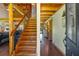 Welcoming entryway featuring wood floors, exposed beams, and a staircase leading to the second floor at 179 Hogan Rd, Brooks, GA 30205