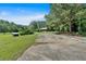 Charming house nestled on a spacious lot with mature trees and a shed, offering a peaceful retreat at 179 Hogan Rd, Brooks, GA 30205