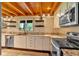 Updated kitchen featuring granite countertops, stainless steel appliances, and wooden ceiling at 179 Hogan Rd, Brooks, GA 30205