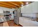 Updated kitchen with stainless steel appliances, granite countertops, and wooden ceiling at 179 Hogan Rd, Brooks, GA 30205