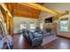 Comfortable living room with a stone fireplace, vaulted ceiling, and ample natural light at 179 Hogan Rd, Brooks, GA 30205