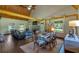 Spacious living room featuring hardwood floors, fireplace and wood beam ceiling at 179 Hogan Rd, Brooks, GA 30205