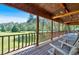A relaxing porch with chairs overlooking a lush green lawn at 179 Hogan Rd, Brooks, GA 30205