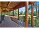 Inviting porch swing with wooden columns, perfect for enjoying the outdoors at 179 Hogan Rd, Brooks, GA 30205