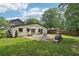 The backyard features a stone patio, fire pit, and a wood fence for entertaining at 1815 Coventry Rd, Decatur, GA 30030