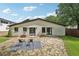 The backyard features a stone patio, seating and a back entrance to the home at 1815 Coventry Rd, Decatur, GA 30030