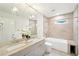 Elegant bathroom with double vanity, tub, and modern fixtures at 1815 Coventry Rd, Decatur, GA 30030