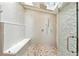 Bright bathroom with a pebble floor shower and glass door at 1815 Coventry Rd, Decatur, GA 30030