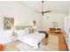 Bright bedroom with wood floors, ceiling fan, and white built-in storage at 1815 Coventry Rd, Decatur, GA 30030