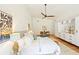 Bright bedroom with wood floors, ceiling fan, and white built-in storage at 1815 Coventry Rd, Decatur, GA 30030