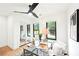 Well-lit bedroom with modern decor, a ceiling fan, and large windows at 1815 Coventry Rd, Decatur, GA 30030