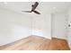 Minimalist bedroom with hardwood floors, a ceiling fan, and bright natural light at 1815 Coventry Rd, Decatur, GA 30030