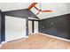This bedroom has hardwood floors, neutral paint, closet, and access to the bathroom at 1815 Coventry Rd, Decatur, GA 30030