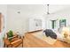 Bright bedroom with wood floors, ceiling fan, and white built-in storage at 1815 Coventry Rd, Decatur, GA 30030