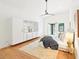 Bright bedroom with wood floors, ceiling fan, and white built-in storage at 1815 Coventry Rd, Decatur, GA 30030