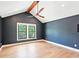 This bedroom features an elegant ceiling fan, hardwood floors, and a window with natural light at 1815 Coventry Rd, Decatur, GA 30030