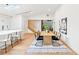 Open-concept dining area with modern decor, a large table, and access to other living spaces at 1815 Coventry Rd, Decatur, GA 30030