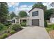 A bright, two-story home features a convenient attached garage and manicured landscaping at 1815 Coventry Rd, Decatur, GA 30030