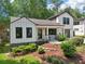 Lovely home featuring a well-kept lawn, stone-lined flower beds, and an appealing modern design at 1815 Coventry Rd, Decatur, GA 30030