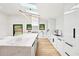 Contemporary kitchen with a white marble island, modern appliances, and skylights at 1815 Coventry Rd, Decatur, GA 30030