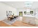 Bright kitchen with marble island, wood floors, modern appliances, and skylights at 1815 Coventry Rd, Decatur, GA 30030