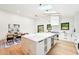 Modern kitchen features a marble island, stainless steel appliances, and skylights for natural lighting at 1815 Coventry Rd, Decatur, GA 30030