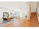 Open-concept kitchen and dining area with skylights, modern appliances, and light wood flooring at 1815 Coventry Rd, Decatur, GA 30030