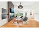 Elegant living room with hardwood floors, modern fireplace, and bright airy windows at 1815 Coventry Rd, Decatur, GA 30030