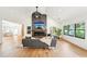 Bright living room featuring wood floors, vaulted ceiling, and a stylish fireplace feature at 1815 Coventry Rd, Decatur, GA 30030