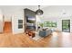 Bright, airy living room with hardwood floors, fireplace, and access to the backyard at 1815 Coventry Rd, Decatur, GA 30030