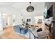 Bright living room with light wood floors, stylish furniture, and modern lighting fixture at 1815 Coventry Rd, Decatur, GA 30030
