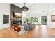 Spacious living room with hardwood floors, fireplace, and plenty of natural light at 1815 Coventry Rd, Decatur, GA 30030
