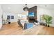 Open-concept living room with hardwood floors, vaulted ceilings, and modern fireplace at 1815 Coventry Rd, Decatur, GA 30030