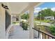 Covered porch with stone tile flooring, providing an inviting outdoor space with neighborhood views at 1815 Coventry Rd, Decatur, GA 30030