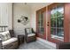 This balcony features outdoor seating and is partially shaded to make for a nice place to relax outside at 2728 Wander Ln, Alpharetta, GA 30022