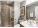 Well-lit bathroom featuring a tile shower, toilet, and sink at 2728 Wander Ln, Alpharetta, GA 30022