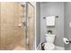Neutral bathroom with a stand up shower and updated fixtures and ceramic tile at 2728 Wander Ln, Alpharetta, GA 30022
