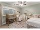 Charming bedroom with a window, crib and furnishings at 2728 Wander Ln, Alpharetta, GA 30022
