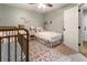 Comfortable bedroom with a large window, ceiling fan and doorway at 2728 Wander Ln, Alpharetta, GA 30022