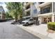 Townhome exterior with a car in the driveway and covered entry at 2728 Wander Ln, Alpharetta, GA 30022