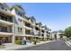 Exterior view of multiple townhomes with driveways and balconies at 2728 Wander Ln, Alpharetta, GA 30022