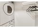Convenient laundry area featuring a stacked washer/dryer and storage at 2728 Wander Ln, Alpharetta, GA 30022