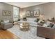 Neutral living room featuring hardwood floors, area rug, and cozy decor at 2728 Wander Ln, Alpharetta, GA 30022